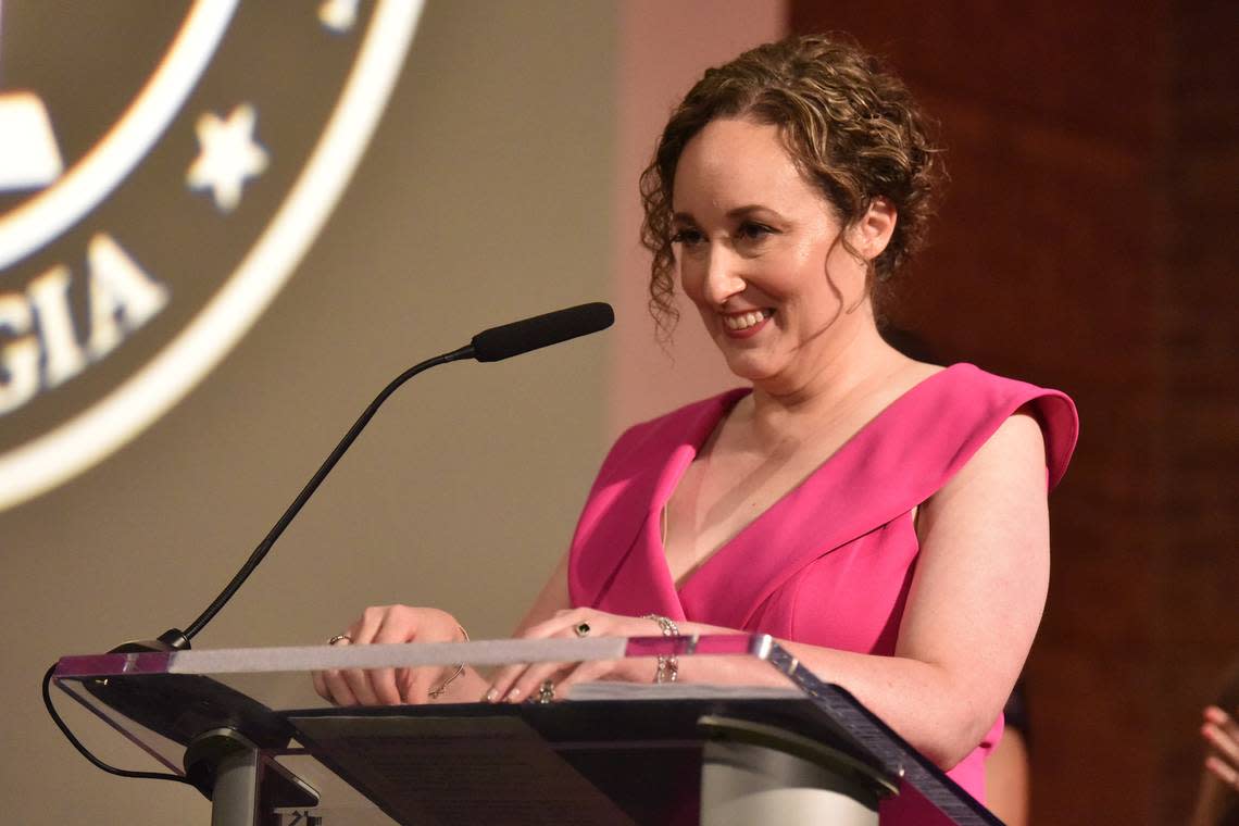 During the Muscogee Educational Excellence Foundation gala May 9, 2024, in the Columbus Convention & Trade Center, Christie Akers of Northside High School stands at the podium after she was announced as the Muscogee County School District 2024 Teacher of the Year.