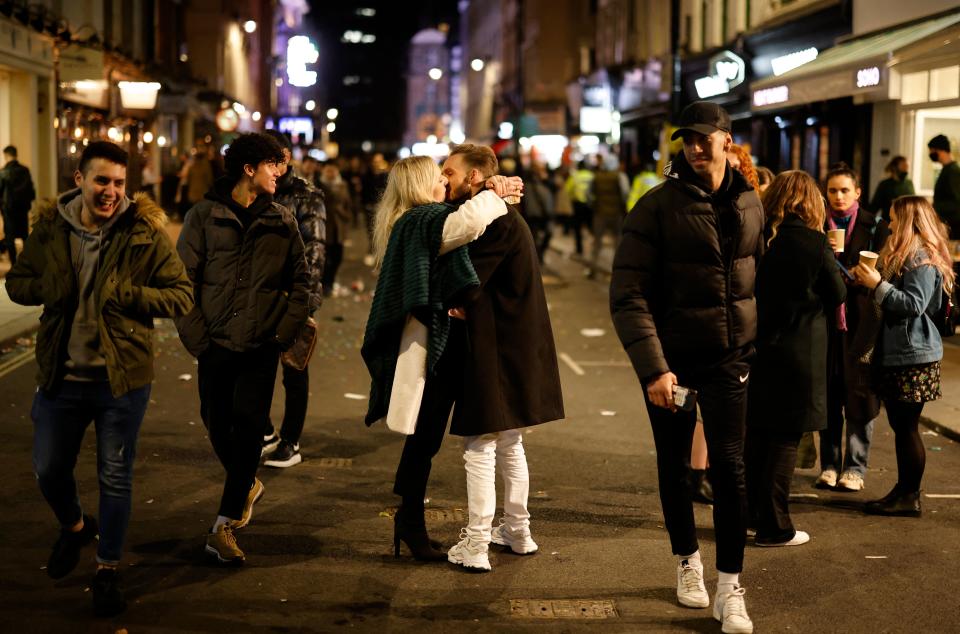 A couple kiss in the strret in the Soho area of London. Source: Getty