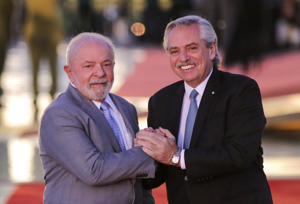 Brazilian President Luiz Inacio Lula da Silva, left, and Argentine President Alberto Fernandez, pose for photos at the Alvorada palace in Brasilia, Brazil, Tuesday, May 2, 2023. AP Photo/Gustavo Moreno)