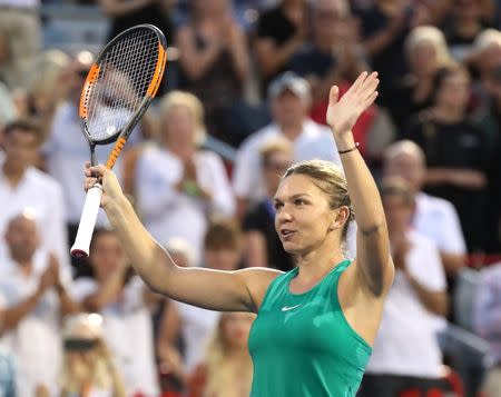 Aug 10, 2018; Montreal, Quebec, Canada; Simona Halep of Romania waves to the crowd after her win against Caroline Garcia of France (not pictured) during the Rogers Cup tennis tournament at Stade IGA. Mandatory Credit: Jean-Yves Ahern-USA TODAY Sports