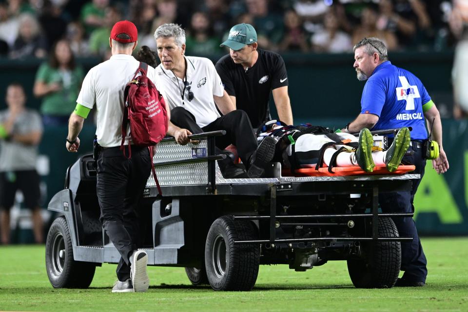 Philadelphia Eagles wide receiver Tyrie Cleveland (85) is brought off the field after an injury during the second half of an NFL preseason football game against the Cleveland Browns on Thursday, Aug. 17, 2023, in Philadelphia. (AP Photo/Derik Hamilton)