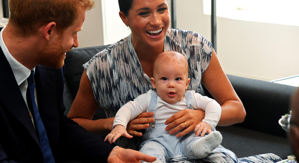 Baby Archie attended his first royal engagement in South Africa with the Duke and Duchess of Sussex in adorable striped dungarees. [Photo: Getty]