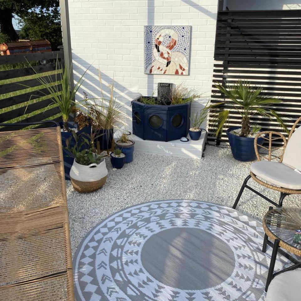 garden makeover with outdoor furniture and rug