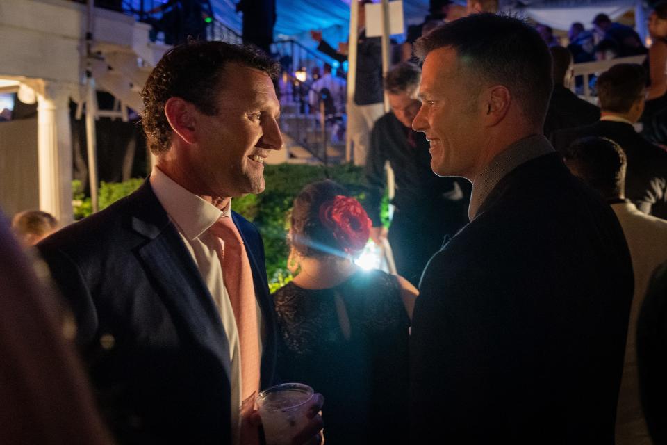 2019 Super Bowl champion New England Patriots quarterback Tom Brady speaks with a guest at the 2019 Barnstable Brown Derby Eve Gala in Louisville. May 3, 2019.