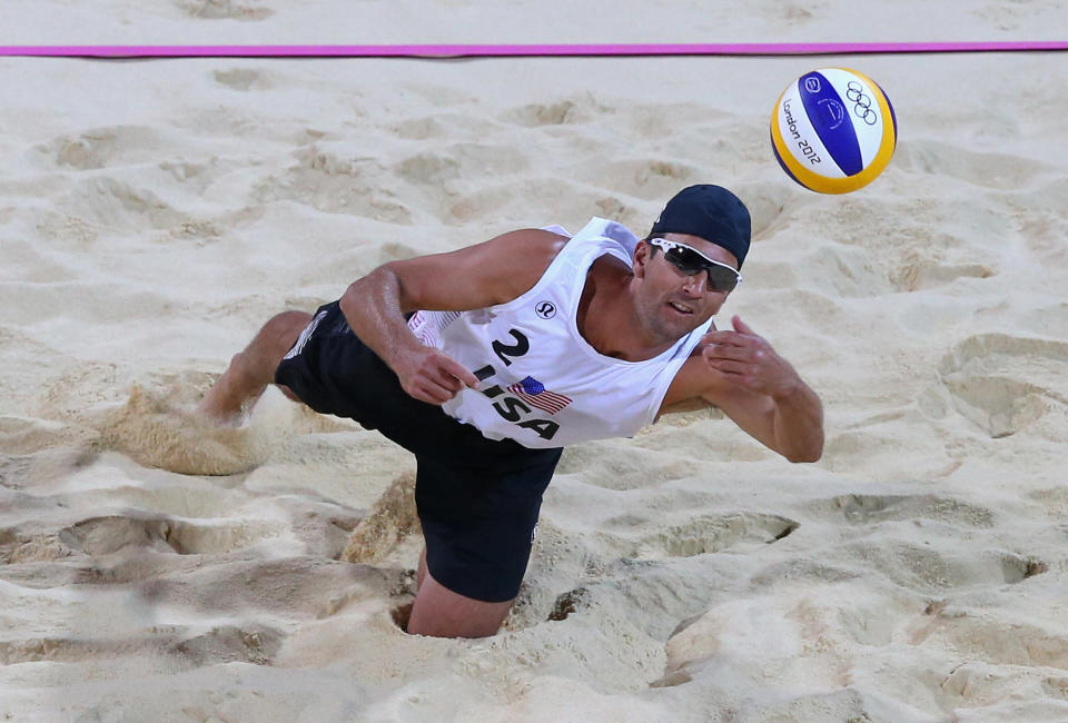 LONDON, ENGLAND - JULY 30: Sean Rosenthal of the United States dives for a shot during the Men's Beach Volleyball Preliminary match between United States and Poland on Day 3 of the London 2012 Olympic Games at Horse Guards Parade on July 30, 2012 in London, England. (Photo by Ryan Pierse/Getty Images)