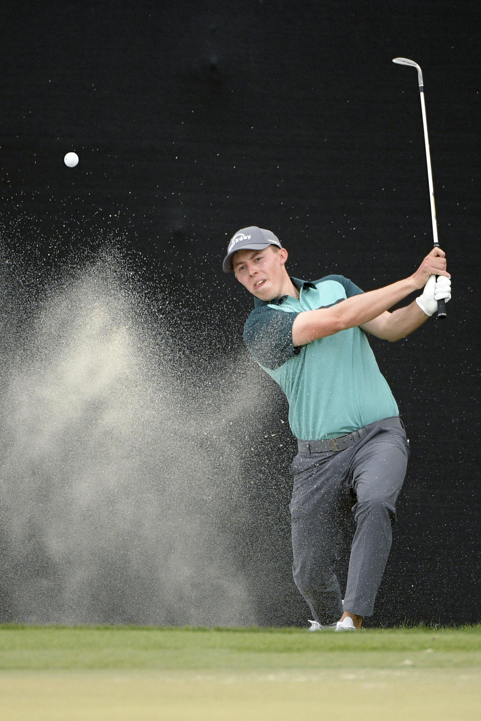 Matthew Fitzpatrick, of England, hits out of a bunker onto the 17th green during the third round of the Arnold Palmer Invitational golf tournament Saturday, March 9, 2019, in Orlando, Fla. (AP Photo/Phelan M. Ebenhack)