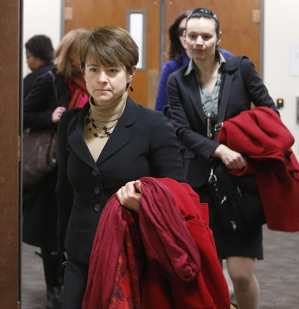 Public defenders representing James Holmes arrive for a hearing for Aurora theater shooting suspect James Holmes at district court in Centennial, Colo., on Friday Jan. 31, 2014. Holmes has pleaded not guilty by reason of insanity to charges of killing 12 people and injuring 70 at a Denver-area movie theater in July 2012. Prosecutors are seeking the death penalty. (AP Photo/Ed Andrieski, Pool)