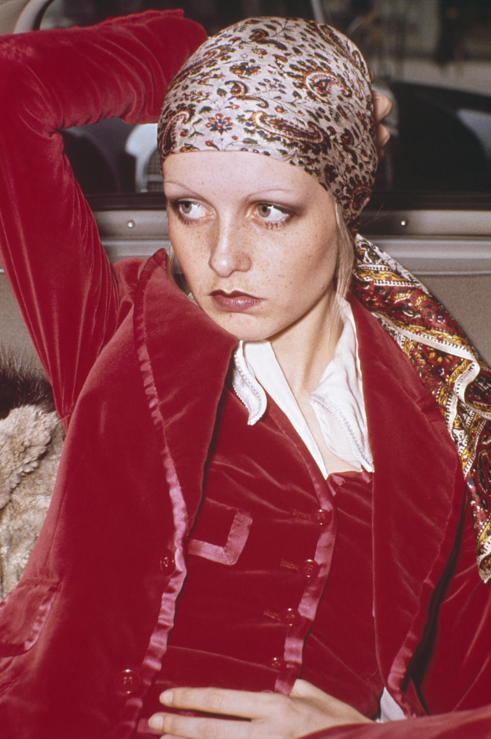 An undated photo of Twiggy wearing a head scarf and velvet suit.&nbsp;