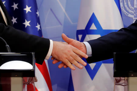 U.S. Secretary of State Mike Pompeo and Israeli Prime Minister Benjamin Netanyahu shake hands as they deliver joint statements during their meeting in Jerusalem March 20, 2019. REUTERS/Jim Young/Pool