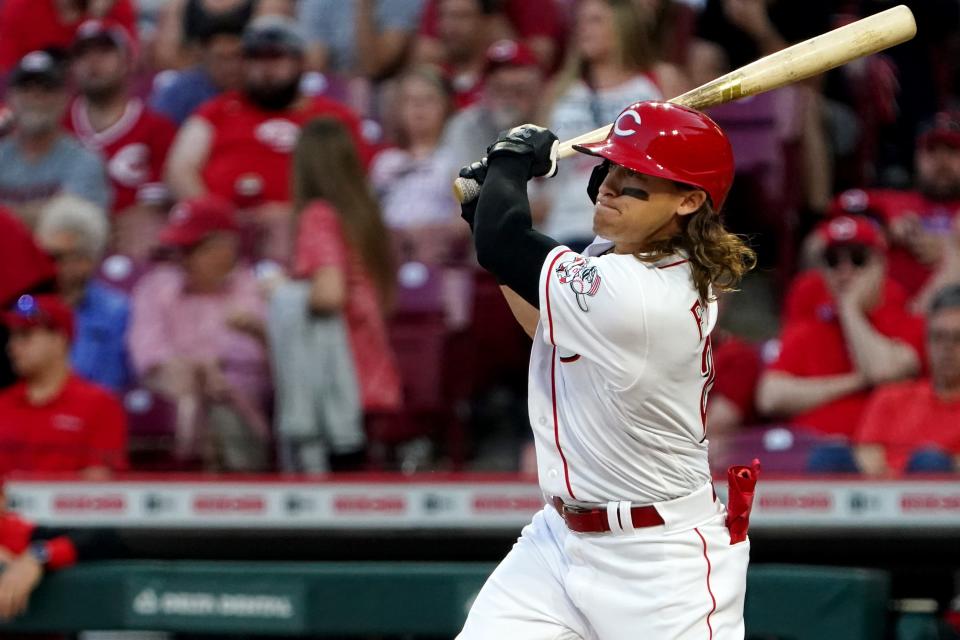 Cincinnati Reds left fielder TJ Friedl (29) hits a two-run double in the fifth inning of a baseball game against the Milwaukee Brewers, Monday, May 9, 2022, at Great American Ball Park in Cincinnati. 