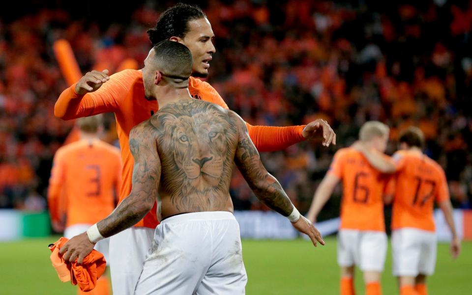 Virgil van Dijk and Memphis Depay celebrate Holland's late win - Getty Images Europe