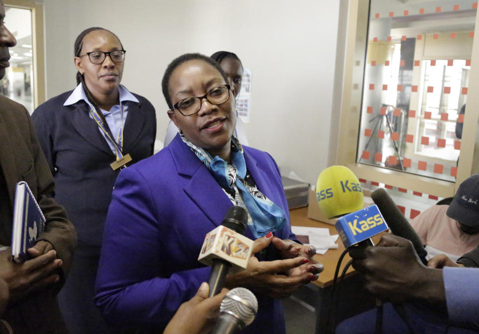 Kenya's health minister Sicily Kariuki speaks to the media about measures the government is taking to prevent Ebola, at the Jomo Kenyatta International Airport in Nairobi, Kenya Monday, June 17, 2019. Kenyan doctors are testing a hospital patient in western Kenya who has Ebola-like symptoms, as eastern Congo is struggling to control the outbreak and Uganda has reported two deaths from the deadly hemorrhagic fever, though Kenya's health minister downplayed the threat Monday. (AP Photo/Khalil Senosi)
