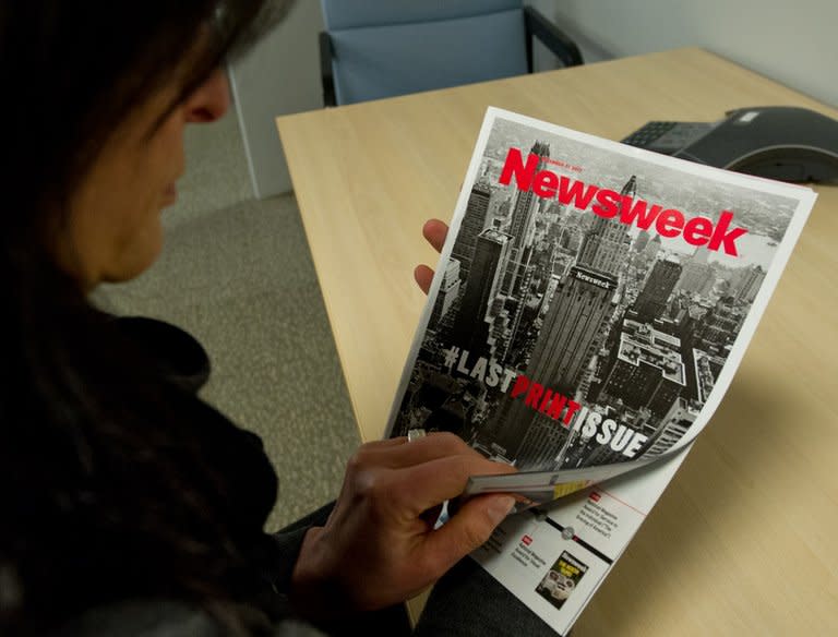 A woman perusing the final print edition of Newsweek in Washington, DC on December 24, 2012. Almost 80 years after first going to print, the final Newsweek magazine hit newsstands featuring an ironic hashtag as a symbol of its Twitter-era transition to an all-digital format