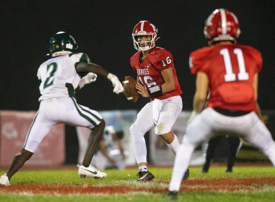 Manalapan quarterback Ryan Dougherty scans the field