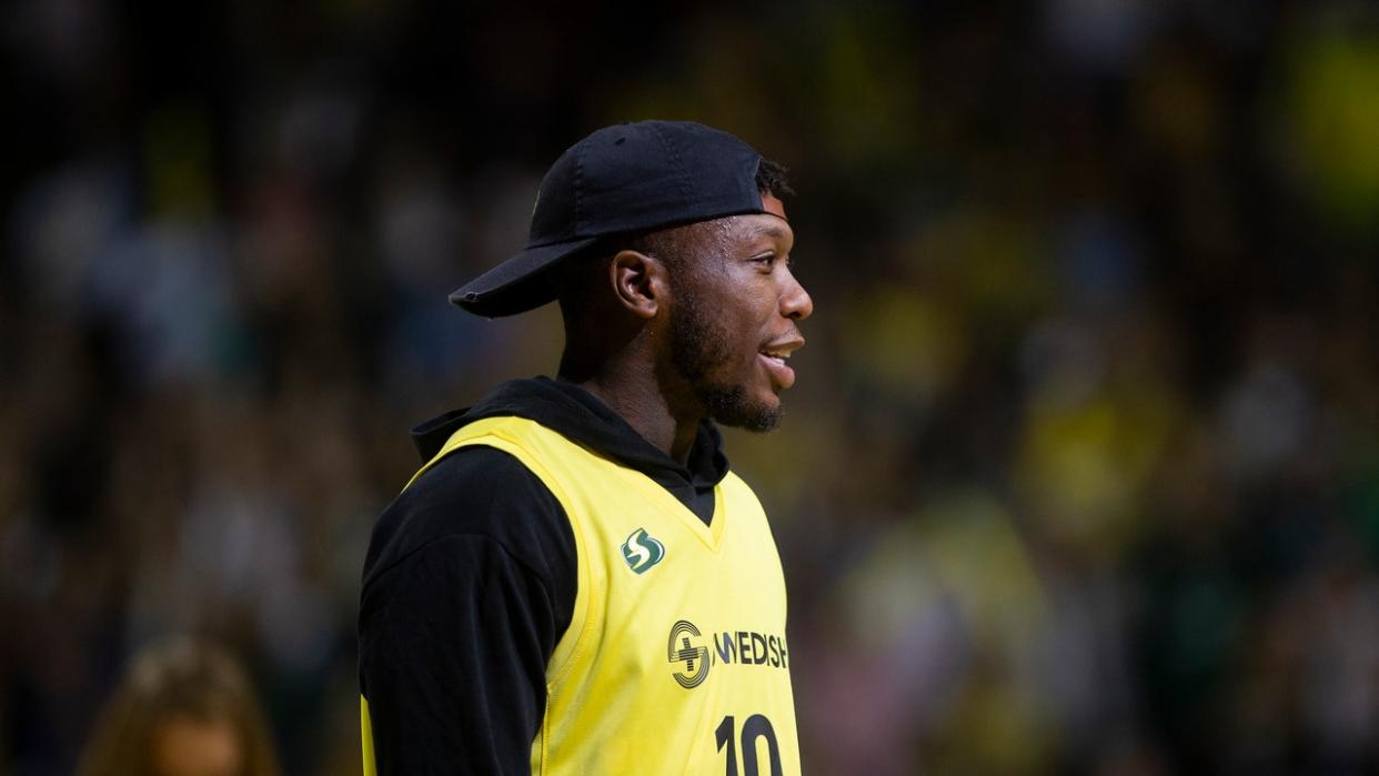 <div>SEATTLE, WA - SEPTEMBER 09: Basketball player Nate Robinson, a Seattle native, is recognized by the crowd during a time out in Game 2 of the WNBA Finals at KeyArena on September 9, 2018 in Seattle, Washington. The Seattle Storm beat the Washington Mystics 75-73. (Photo by Lindsey Wasson/Getty Images)</div>