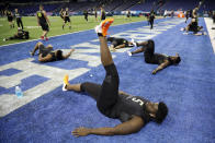 Louisville offensive lineman Mekhi Becton stretches at the NFL football scouting combine in Indianapolis, Friday, Feb. 28, 2020. (AP Photo/Charlie Neibergall)