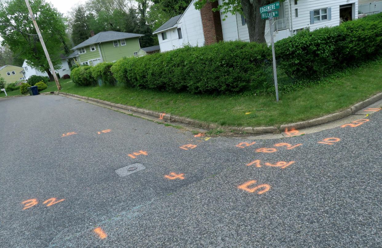 Evidence markers fill the corner Monday, May 16, 2022, where Marques Mills was gunned down at Hillview Drive and Edgemere Road in Neptune Township.  The Monmouth County Prosecutors office reports that police responded to a report of a shooting shortly before 11 p.m. on Saturday and found Mills in a vehicle having sustained multiple gunshot wounds.