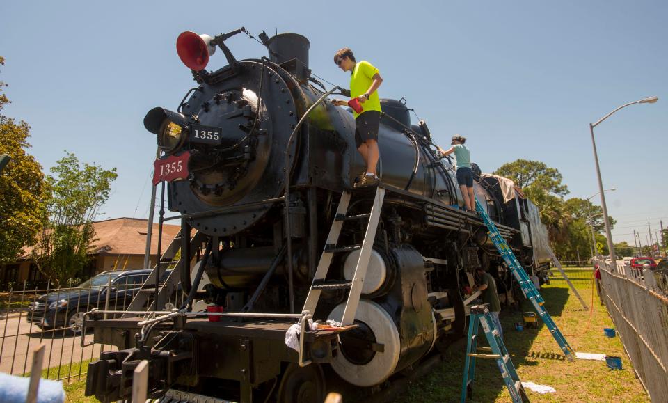 Volunteers worked on restoring the Frisco 1355, also called u0022The Pride of Pensacola,u0022 on Garden Street in May 2019. Work on the iconic train was part of Zach Panici's Eagle Scout service project.