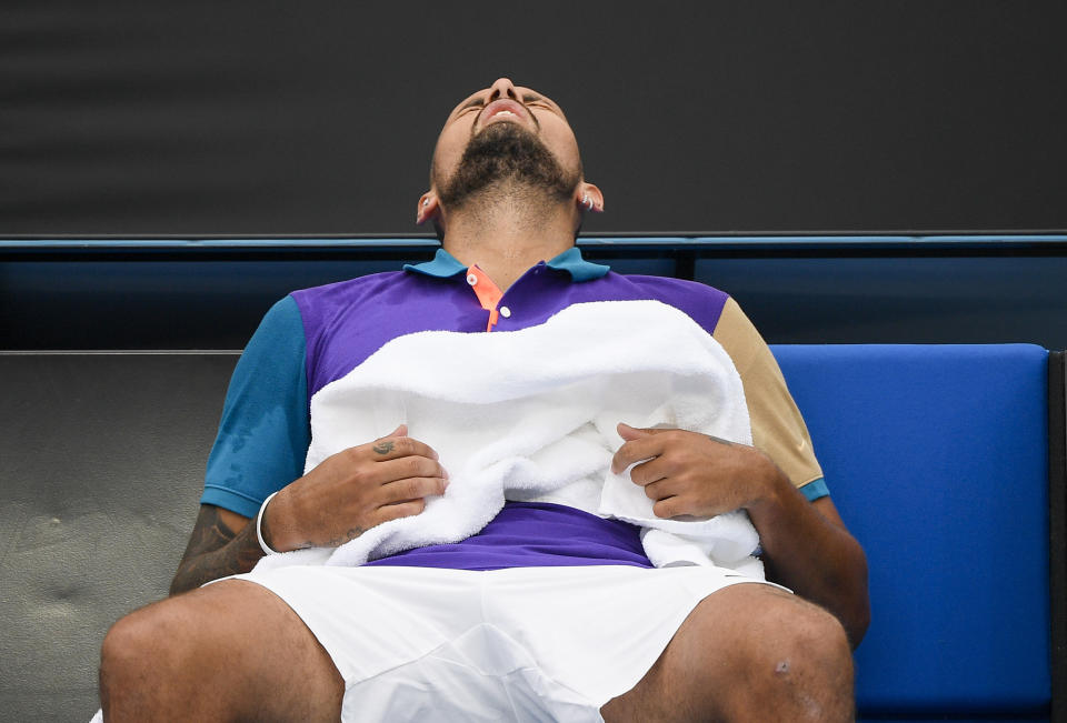 Australia's Nick Kyrgios reacts during a break in his match against France's Alexandre Muller at a tuneup tournament ahead of the Australian Open tennis championships in Melbourne, Australia, Tuesday, Feb. 2, 2021. (AP Photo/Andrew Brownbill)