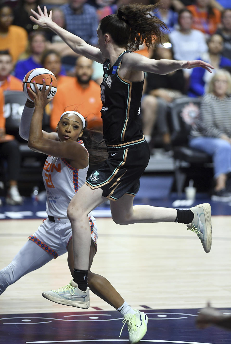 Connecticut Sun's DiJonai Carrington (21) has a shot blocked by New York Liberty's Breanna Stewart (30) during the first half of a WNBA basketball game, Tuesday, June 27, 2023 at Mohegan Sun Arena in Uncasville, Conn. (Sarah Gordon/The Day via AP)