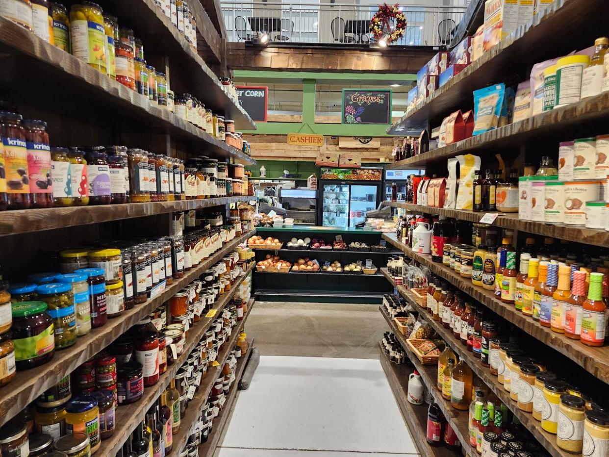 Groceries line the shelves at the Covent Garden Market, a staple for takeout and groceries in downtown London, Ont.  (Arfa Rana/CBC - image credit)