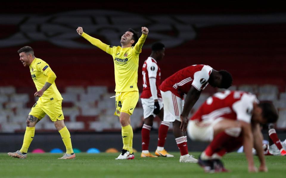 Villareal's Juan Foyth, left, and Villareal's Manu Trigueros, centre, celebrate at the end of the Europa League semifinal second leg soccer match between Arsenal and Villarreal - AP