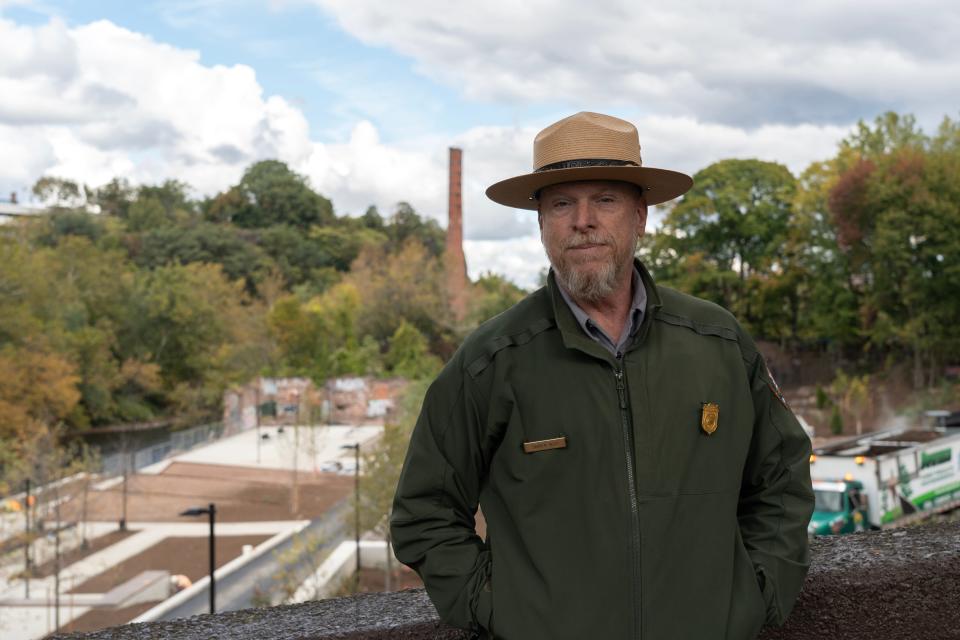 Superintendent at Paterson Great Falls National Historical Park Darren Boch tours the quarry lawn area under construction along the Passaic River, below the Great Falls in Paterson, NJ on Tuesday Oct. 17, 2023.