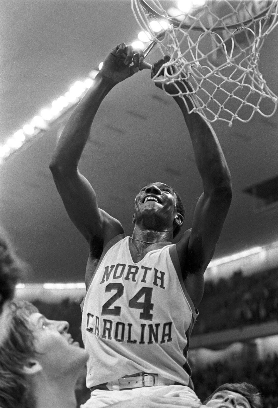 UNC’s Walter Davis cuts down the nets after the Tar Heels defeated N.C. State to win the 1975 ACC Tournament championship game.