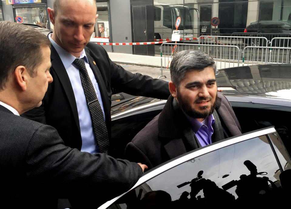 FILE - In this Tuesday, Feb. 2, 2016 file photo, Army of Islam official Mohammed Alloush, gets in to a car heading to a meeting with the opposition's High Negotiations Committee, in Geneva, Switzerland. Syrian rebels are sending representatives next week to the capital of Kazakhstan for talks with government representatives. With the loss of Aleppo, the election of Donald Trump and the pivot of Turkey toward Russia, the opposition has very little room to maneuver. Without much foreign support and with the wider rebellion in crisis, the opposition will be negotiating for scraps.(AP Photo/Bassem Mroue, File)