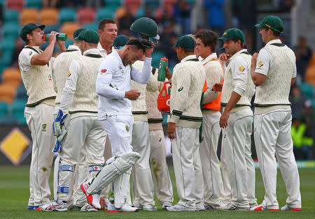 Cricket - Australia v South Africa - Second Test cricket match - Bellerive Oval, Hobart, Australia - 12/11/16 Australia's Josh Hazlewood celebrates with team mates after dismissing South Africa's captain Faf du Plessis. REUTERS/David Gray