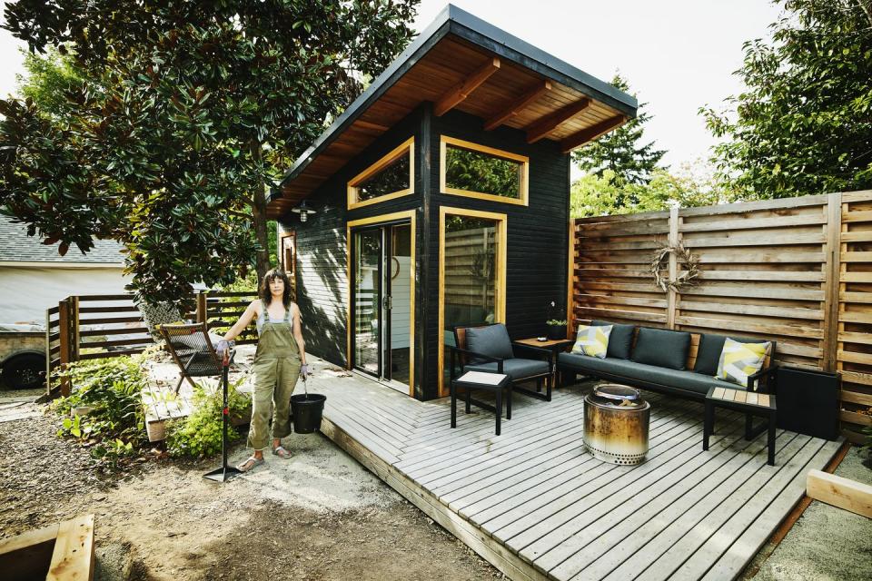 summer activities woman working on backyard home improvement project