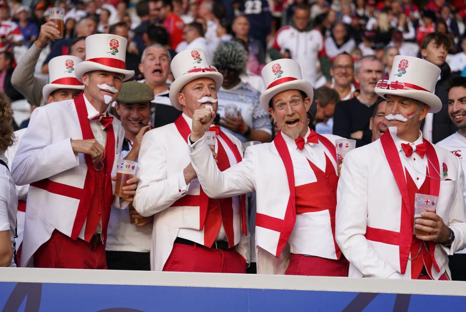 England fans enjoy themselves before kick-off (PA)