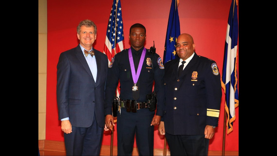 Sergeant Javed Richards (center) receiving a commendation in 2015.