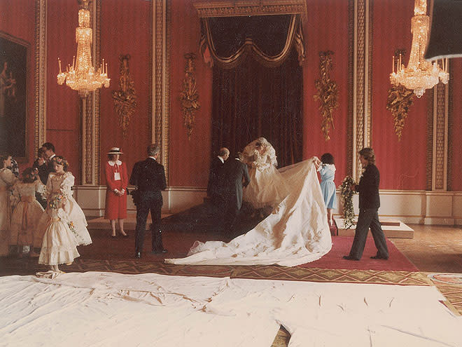 <p>Diana – and her long (25 foot!) train – prepare for the day's official portraits.</p>