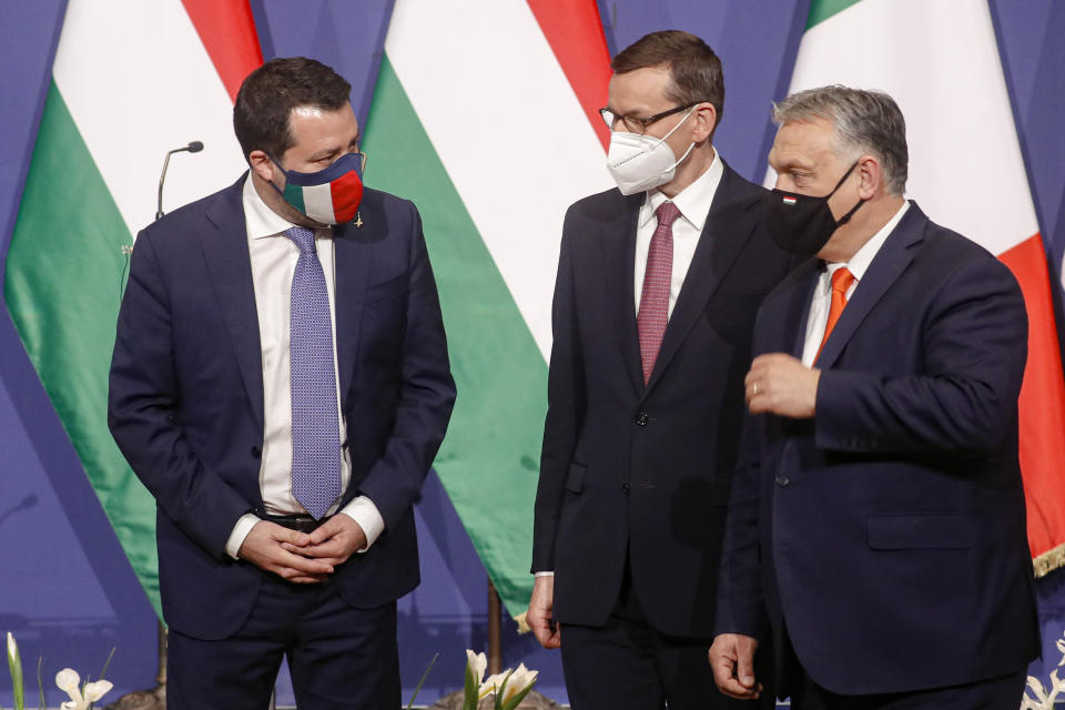 Hungarian prime minister Viktor Orban, right, Poland's prime minister, Matteusz Morawiecki, center, and former interior minister of Italy, Matteo Salvini speak after a joint press conference in Budapest, Hungary, Thursday, April 1, 2021. Hungarian prime minister Viktor Orban hosted talks with right-wing politicians, Poland's prime minister, Matteusz Morawiecki, and former interior minister of Italy, Matteo Salvini, a potential opening step toward a new populist political force on the European stage. (AP Photo/Laszlo Balogh)