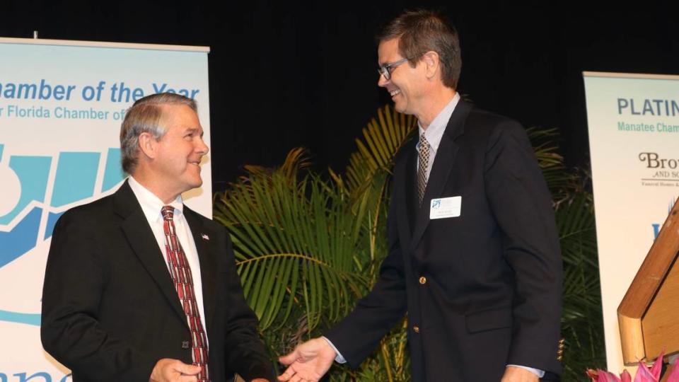 During the Manatee Chamber of Commerce’s 59th annual dinner in Palmetto on 1/27/2022, outgoing board chairman Phill Baker, left, welcomed incoming chairman Rick Besio.