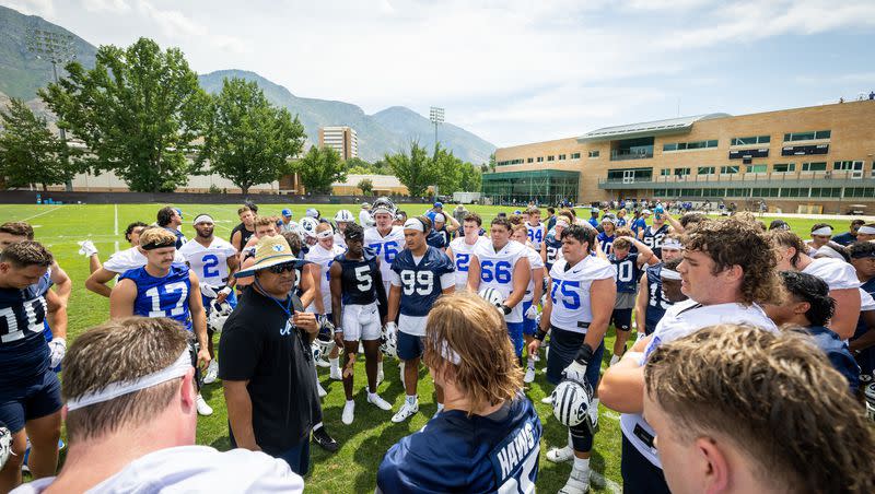 BYU football coach Kalani Sitake talks to his players during BYU’s first day of fall camp on Thursday, Aug. 4, 2022.