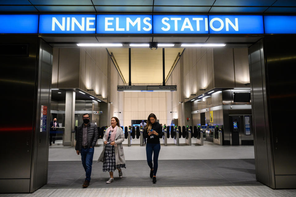 LONDON, ENGLAND - SEPTEMBER 20: Three people walk from Nine Elms underground station after it opens for the first time on September 20, 2021 in London, England. The extension provides Northern Line tube service to Nine Elms and Battersea Power Station, areas that have seen extensive redevelopment in recent years. The historic power station, which closed in 1983 and once generated electricity for a fifth of London homes, will reopen next summer as a home to shops, restaurants and the main UK office of Apple. (Photo by Leon Neal/Getty Images)