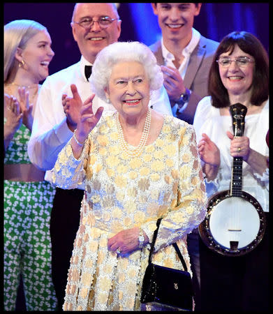 Britain's Queen Elizabeth waves during a special concert "The Queen's Birthday Party" to celebrate her 92nd birthday at the Royal Albert Hall in London, Britain April 21, 2018. Andrew Parsons/Pool via Reuters