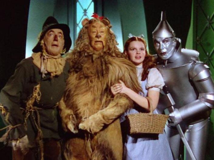 the wizard of oz cast scarecrow, cowardly lion, dorothy, and the tin man