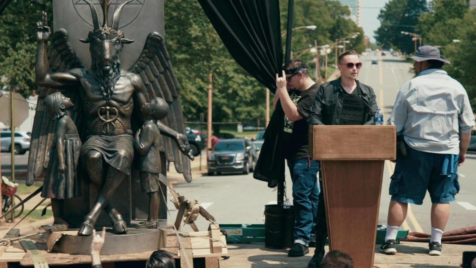 Lucien Greaves delivering a speech in front of the state capitol building in Little Rock, Arkansas in Hail Satan?