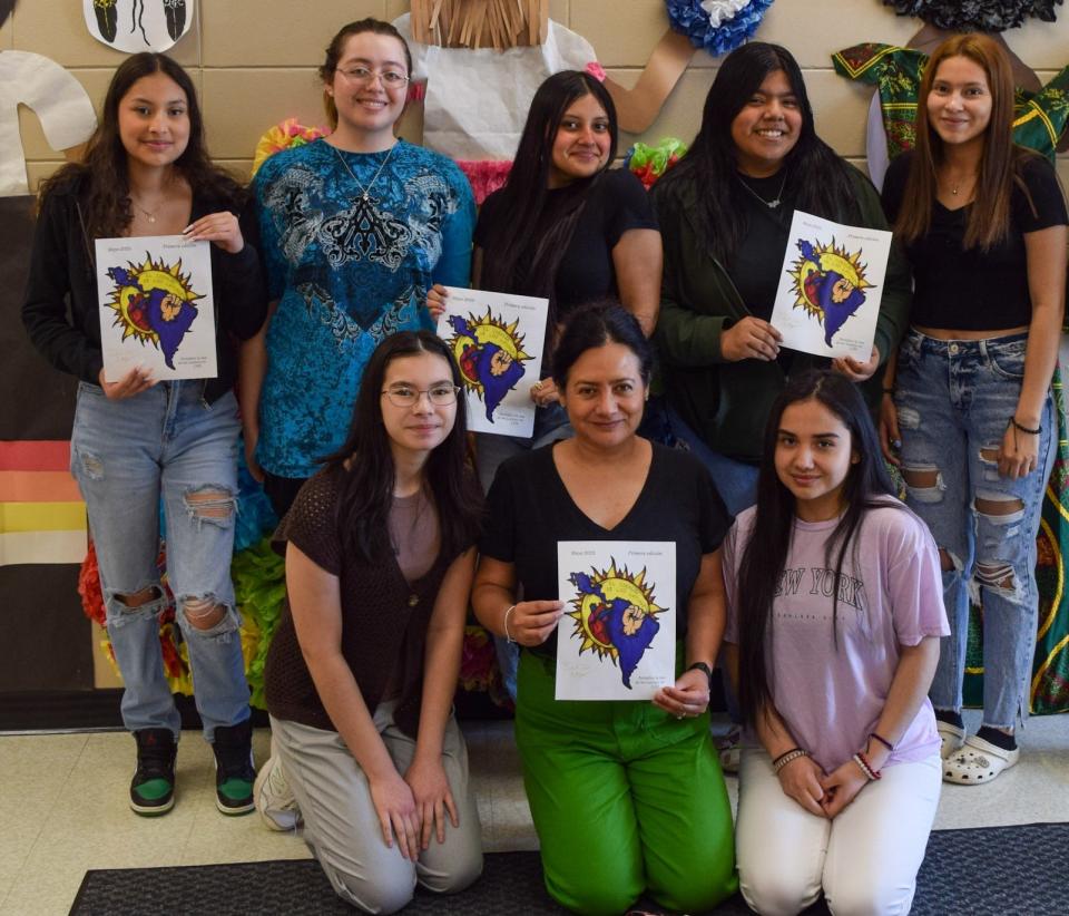 The student writers, designers and editors of "El Corazón de los Latinos" pose for a photo with their teacher and advisor Mónica Cano-Conover in the English Language Learner wing at Lincoln High School on May 8, 2023.