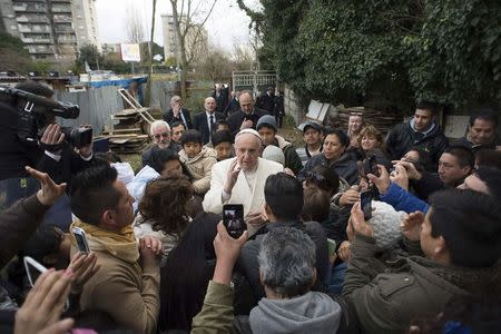 Pope Francis visits a shantytown on the outskirts of Rome February 8, 2015. REUTERS/Osservatore Romano