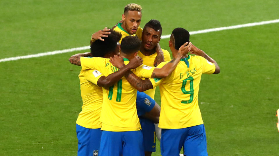 Brazil’s forwards celebrate during their comfortable victory over Serbia