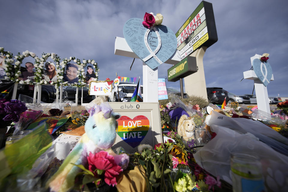 Crosses for the victims stand as part of a makeshift memorial near the scene of a mass shooting at a gay nightclub Wednesday, Nov. 23, 2022, in Colorado Springs, Colo. The alleged shooter facing possible hate crime charges in the fatal shooting of five people at a Colorado Springs gay nightclub is scheduled to make their first court appearance Wednesday from jail after being released from the hospital a day earlier. (AP Photo/David Zalubowski)