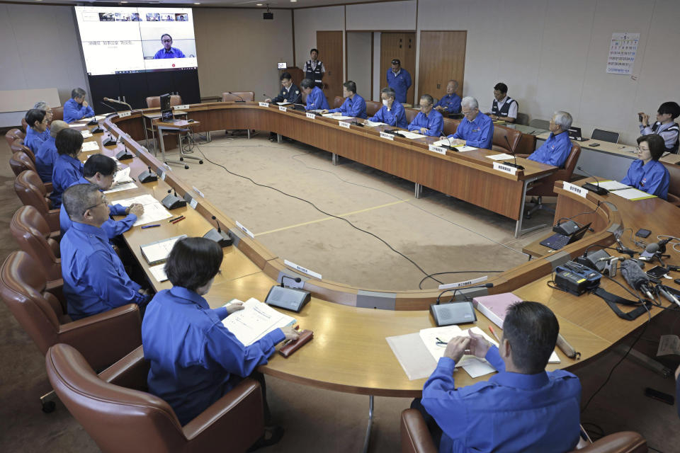 A crisis-management task force meeting is held at prefectural headquarters in Okinawa, southern Japan Tuesday, May 28, 2024. A rocket launched by North Korea to deploy the country's second spy satellite exploded shortly after liftoff Monday, state media reported, in a setback for leader Kim Jong Un's hopes to field satellites to monitor the U.S. and South Korea. (Kyodo News via AP)