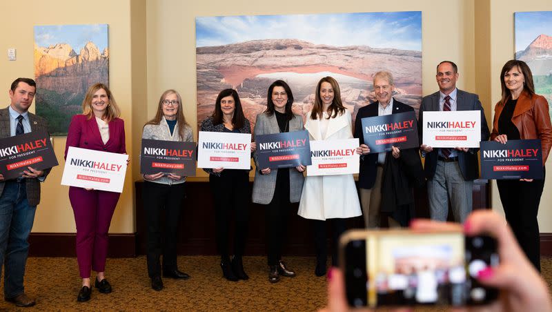 A group, including Utah Lt. Gov. Deidre Henderson, first lady Abby Cox, state lawmakers, business leaders and community members, pose for a photo after announcing their endorsement of Republican presidential candidate Nikki Haley along with at the Utah state Capitol in Salt Lake City on Thursday, Jan. 11, 2024.