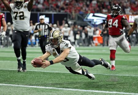 Sep 23, 2018; Atlanta, GA, USA; New Orleans Saints quarterback Drew Brees (9) dives for a rushing touchdown in the fourth quarter against the Atlanta Falcons at Mercedes-Benz Stadium. Mandatory Credit: Jason Getz-USA TODAY Sports