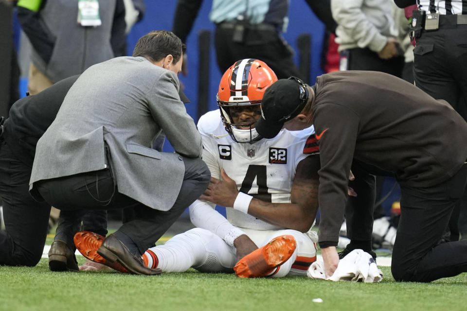 Cleveland Browns quarterback Deshaun Watson (4) sits on the field after getting injured during the first half of an NFL football game against the Indianapolis Colts, Sunday, Oct. 22, 2023, in Indianapolis. (AP Photo/Michael Conroy)