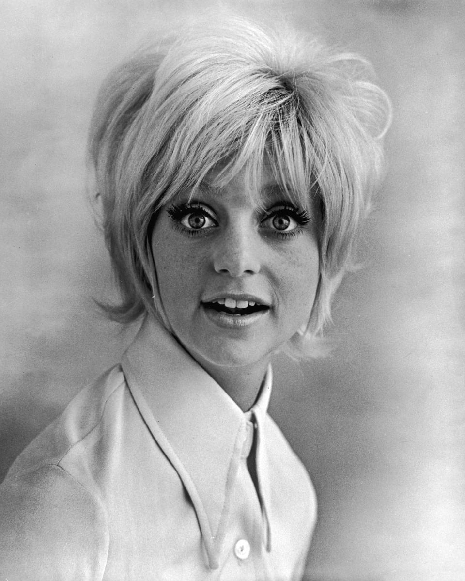 Promorional studio headshot portrait of American actor Goldie Hawn wearing a wide collared shirt for the film, 'Cactus Flower,' directed by Gene Saks, 1969. (Photo by Columbia Pictures/Authenticated News/Courtesy of Getty Images)